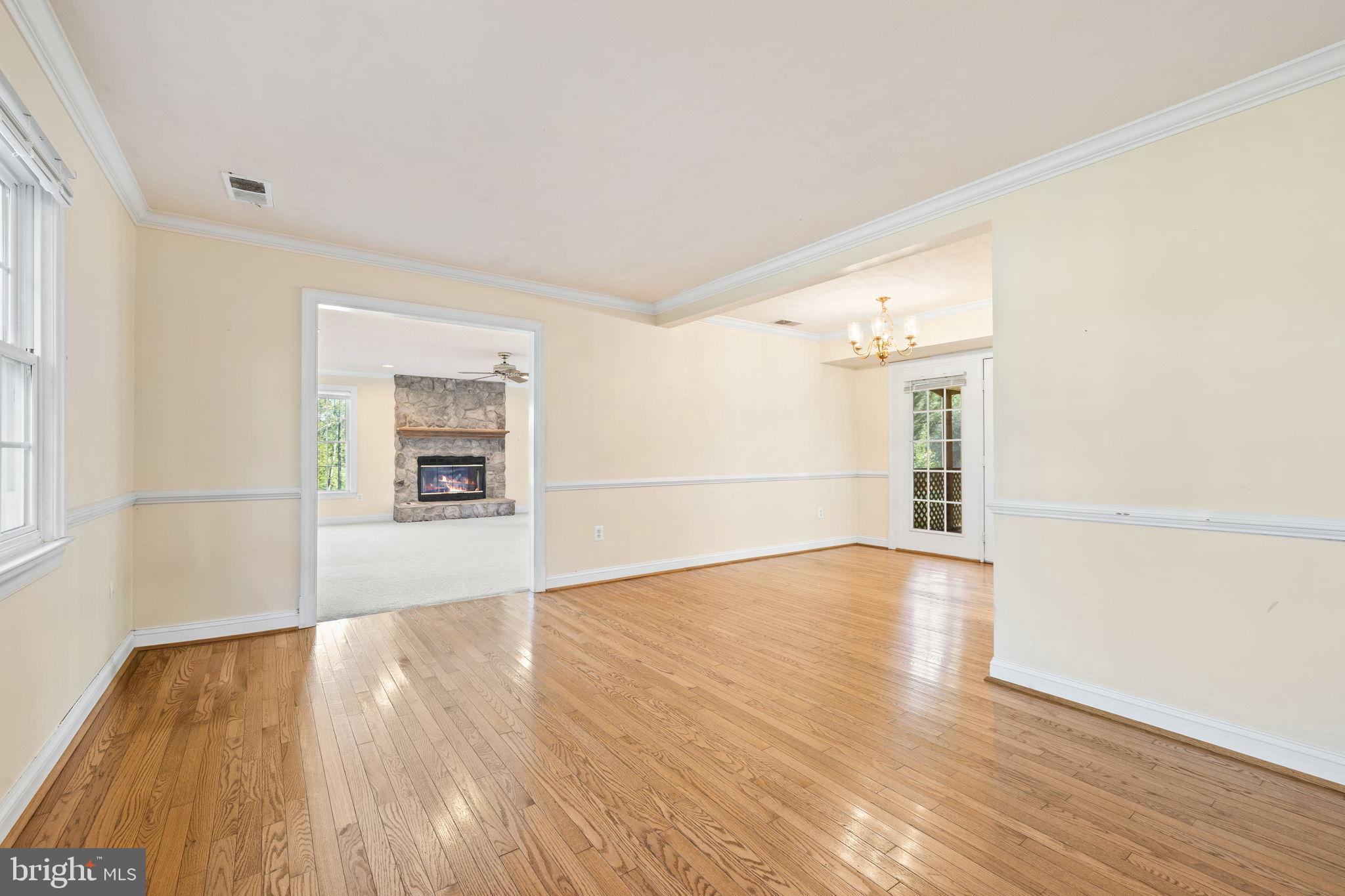 Spacious, sunlit living area with charm.