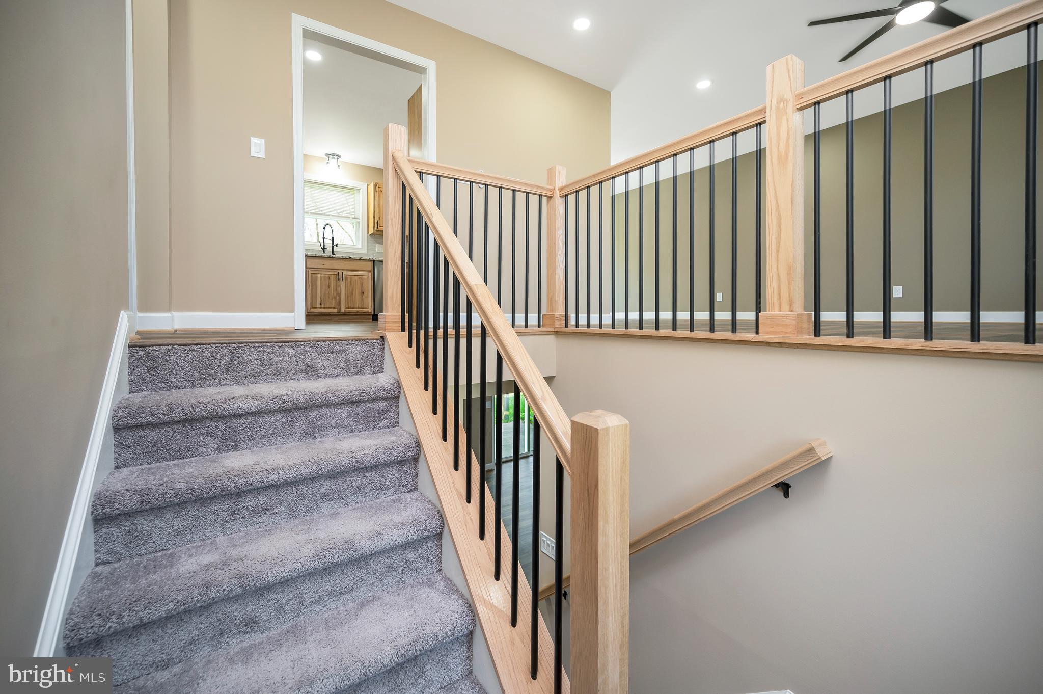 13452 Post Oak Road Spotsylvania, VA 22551 - Photo 14 of 56 a view of a hallway with staircase and white walls