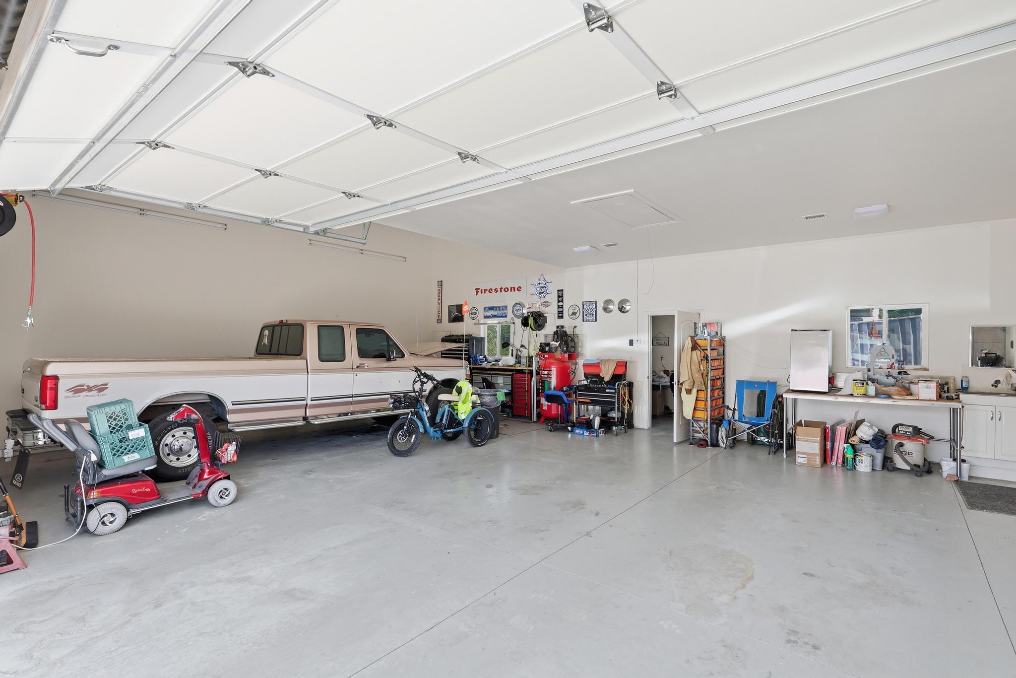1211 Heather Circle Payson, AZ 85541 - Photo 42 of 51 a view of a garage with a bike and white walls