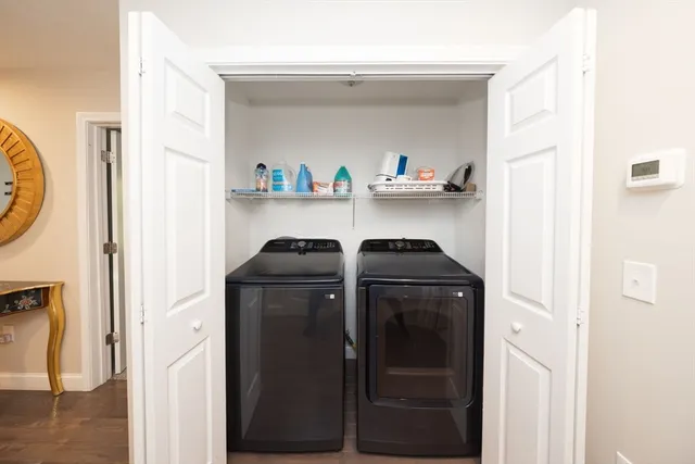 a view of a livingroom with a ceiling fan and window