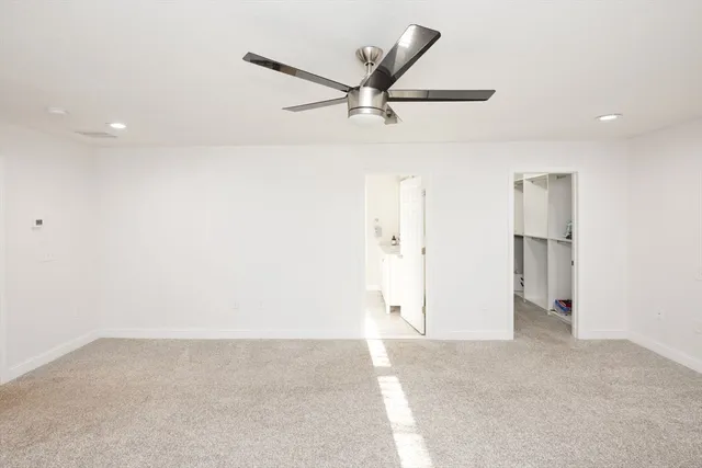 a bathroom with a granite countertop sink a bathtub and a shower