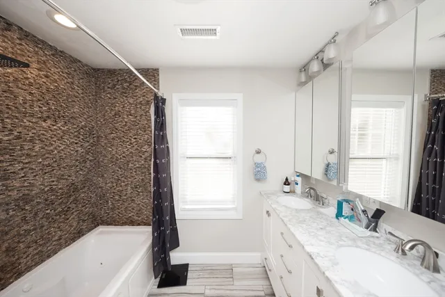 a bathroom with a sink a toilet and a bathtub
