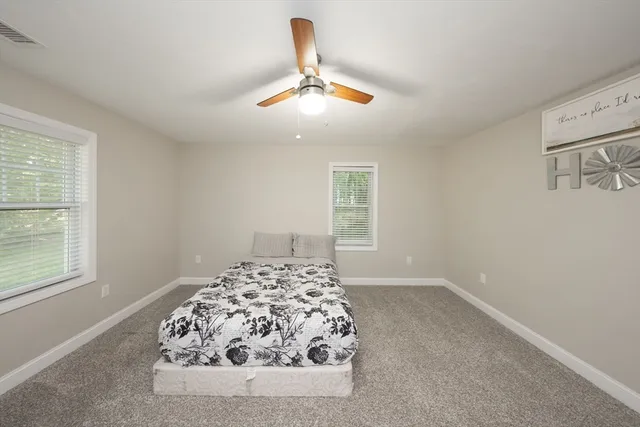 a bathroom with a sink mirror and vanity
