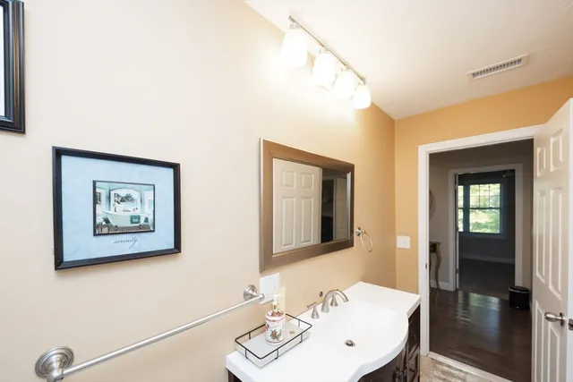 a view of backyard with deck and garden