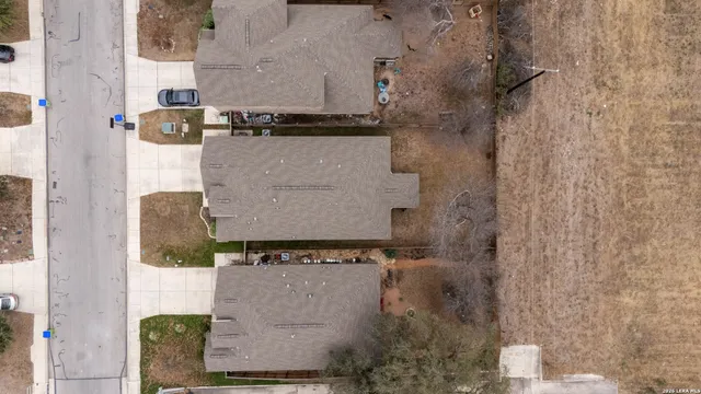 an aerial view of residential house with outdoor space