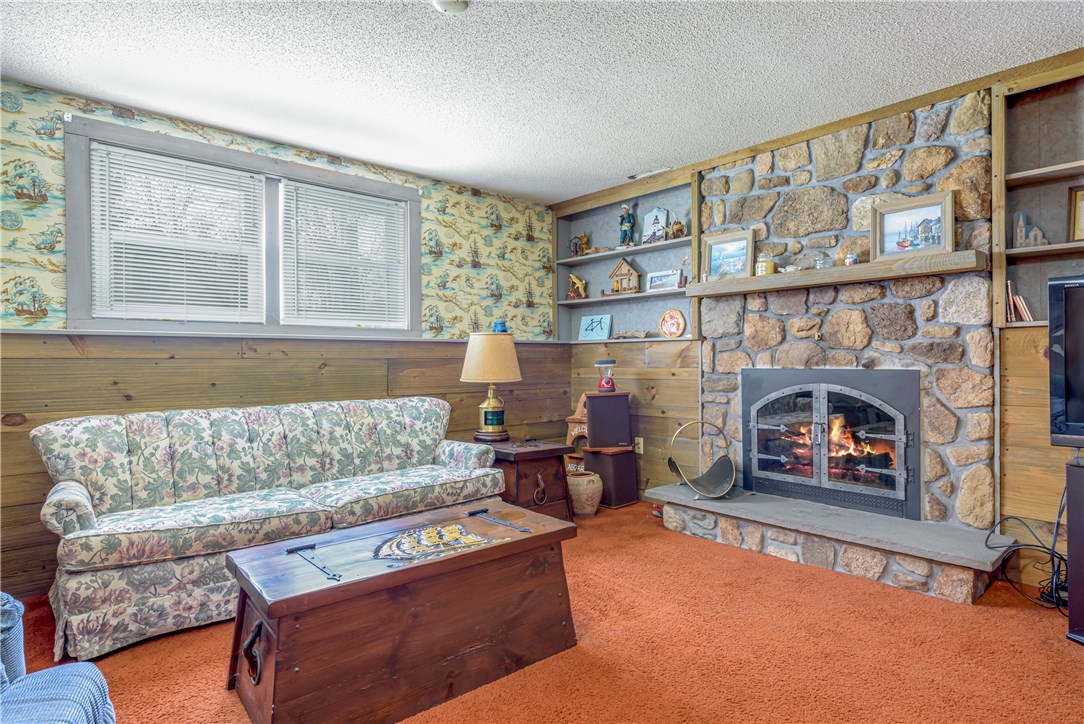46 Indian Hill Road Tiverton, RI 02878 - Photo 13 of 21 Finished family room downstairs with a second fireplace.