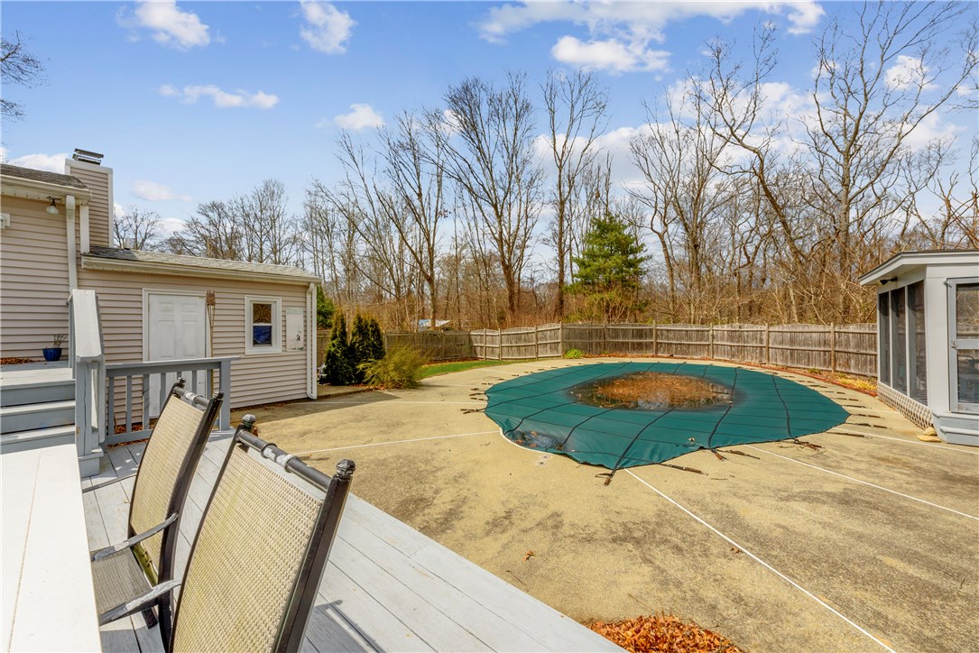 46 Indian Hill Road Tiverton, RI 02878 - Photo 15 of 21 From the deck looking down at the in ground pool.