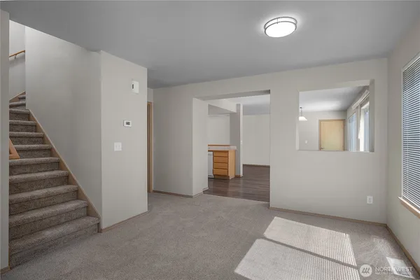 a view of an empty room with glass door