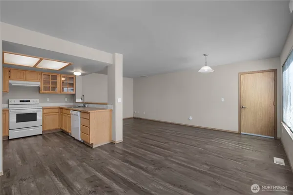 a kitchen that has a sink and a stove in it