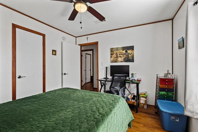 a bed room with a bed and a chandelier