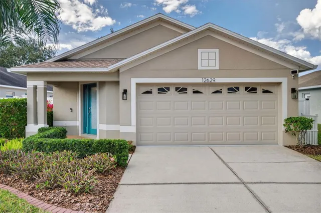a view of a house with a garage