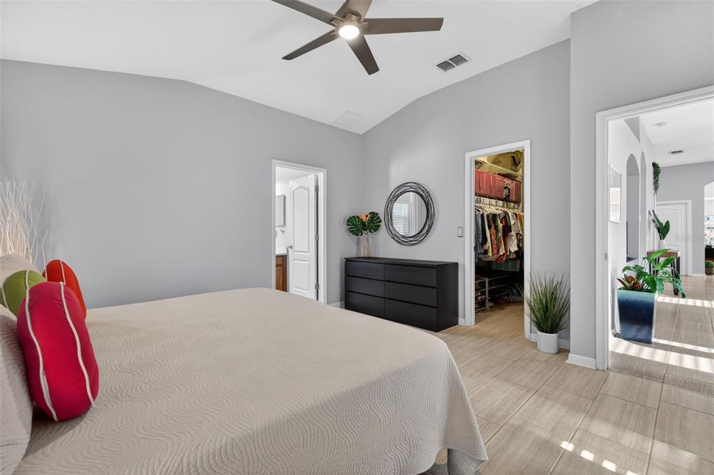 12629 White Bluff Road Hudson, FL 34669 - Photo 12 of 38 a bedroom with a bed and a mirror on the dresser