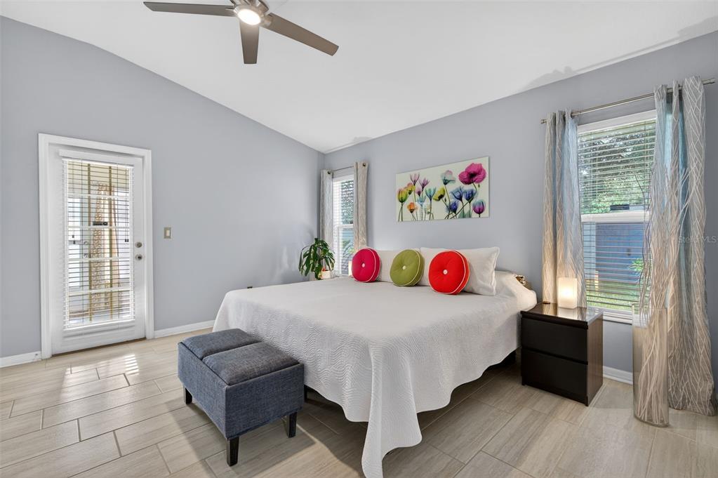 12629 White Bluff Road Hudson, FL 34669 - Photo 14 of 38 a bedroom with a bed and a large window