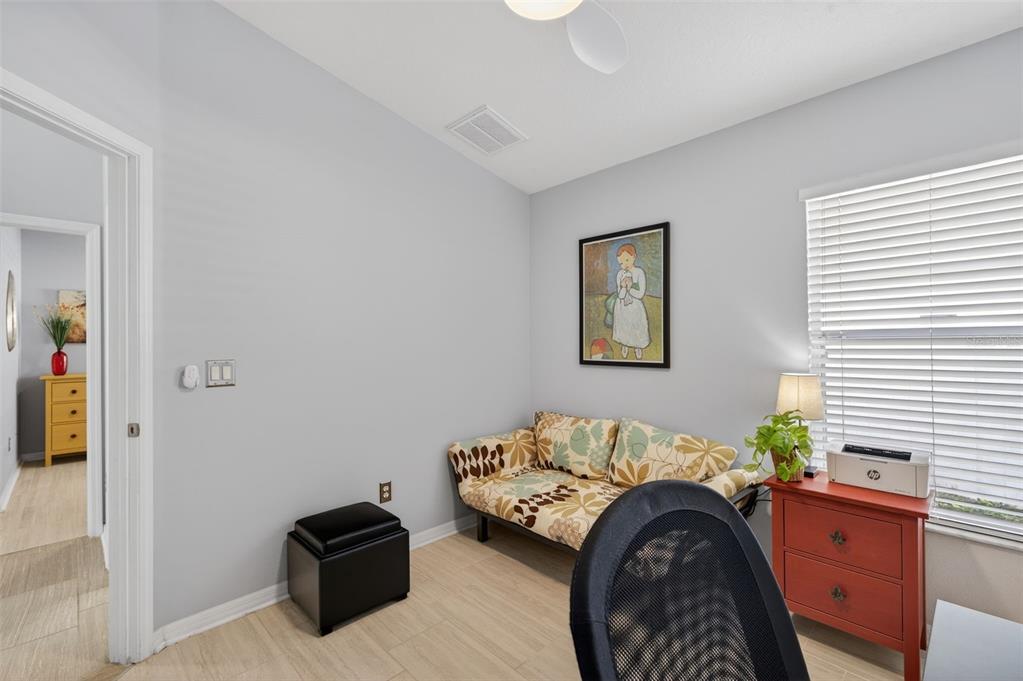 12629 White Bluff Road Hudson, FL 34669 - Photo 18 of 38 a bedroom with furniture and a window