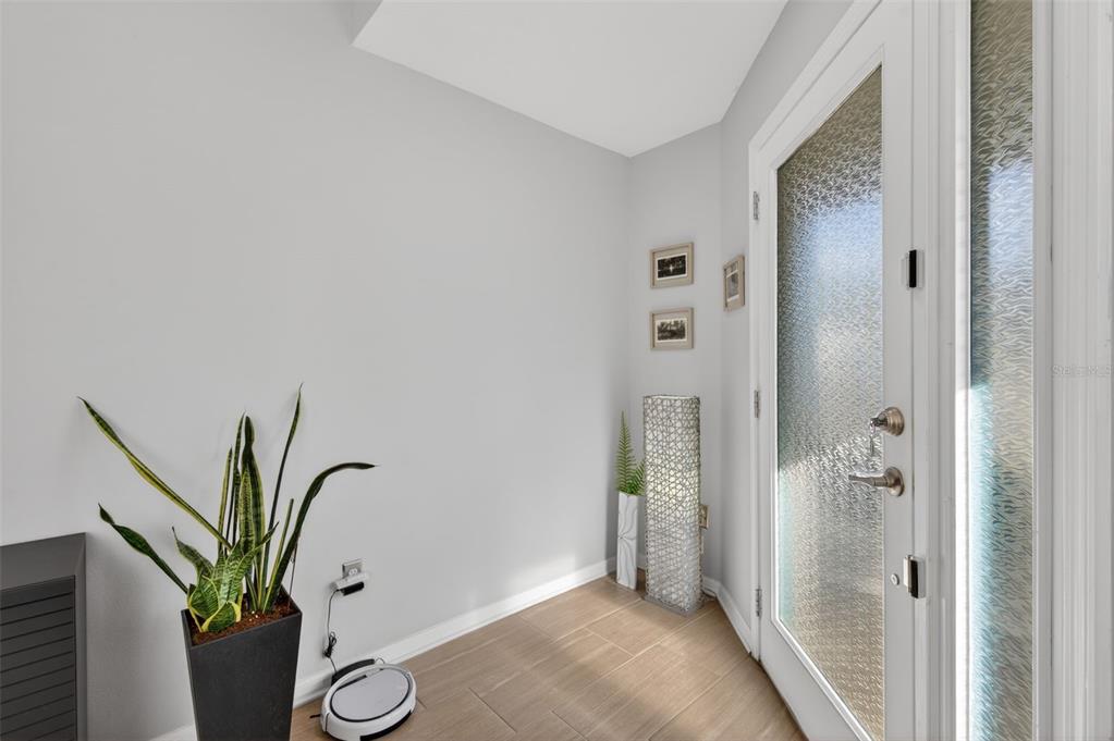 12629 White Bluff Road Hudson, FL 34669 - Photo 2 of 38 a view of a hallway with paintings on the wall