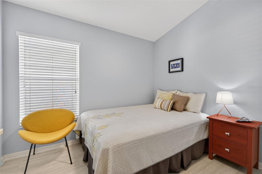 12629 White Bluff Road Hudson, FL 34669 - Photo 21 of 38 a bedroom with a bed and a fish tank on dresser