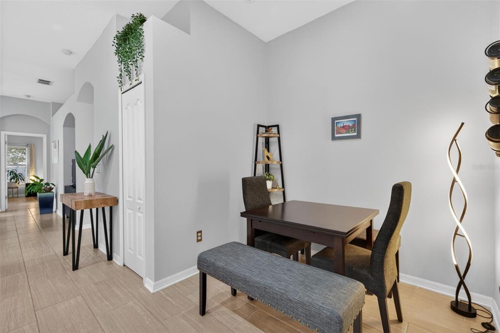 12629 White Bluff Road Hudson, FL 34669 - Photo 8 of 38 a view of a livingroom with furniture and a potted plant