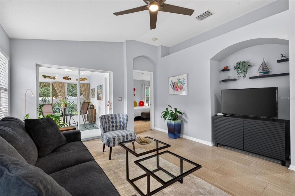 12629 White Bluff Road Hudson, FL 34669 - Photo 9 of 38 a living room with furniture and a flat screen tv