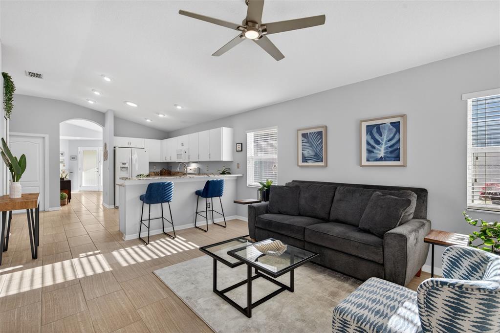 12629 White Bluff Road Hudson, FL 34669 - Photo 10 of 38 a living room with furniture and kitchen view