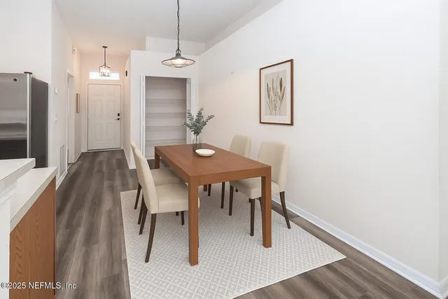 a view of a dining room with furniture