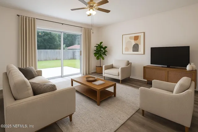 a living room with furniture and a flat screen tv