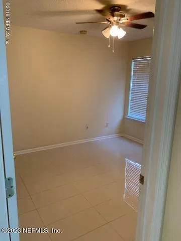 a view of a small space with a fan