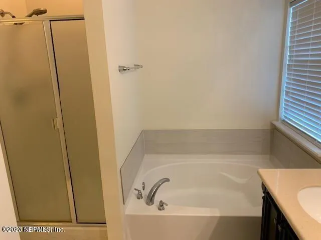 a white toilet sitting next to a white wall