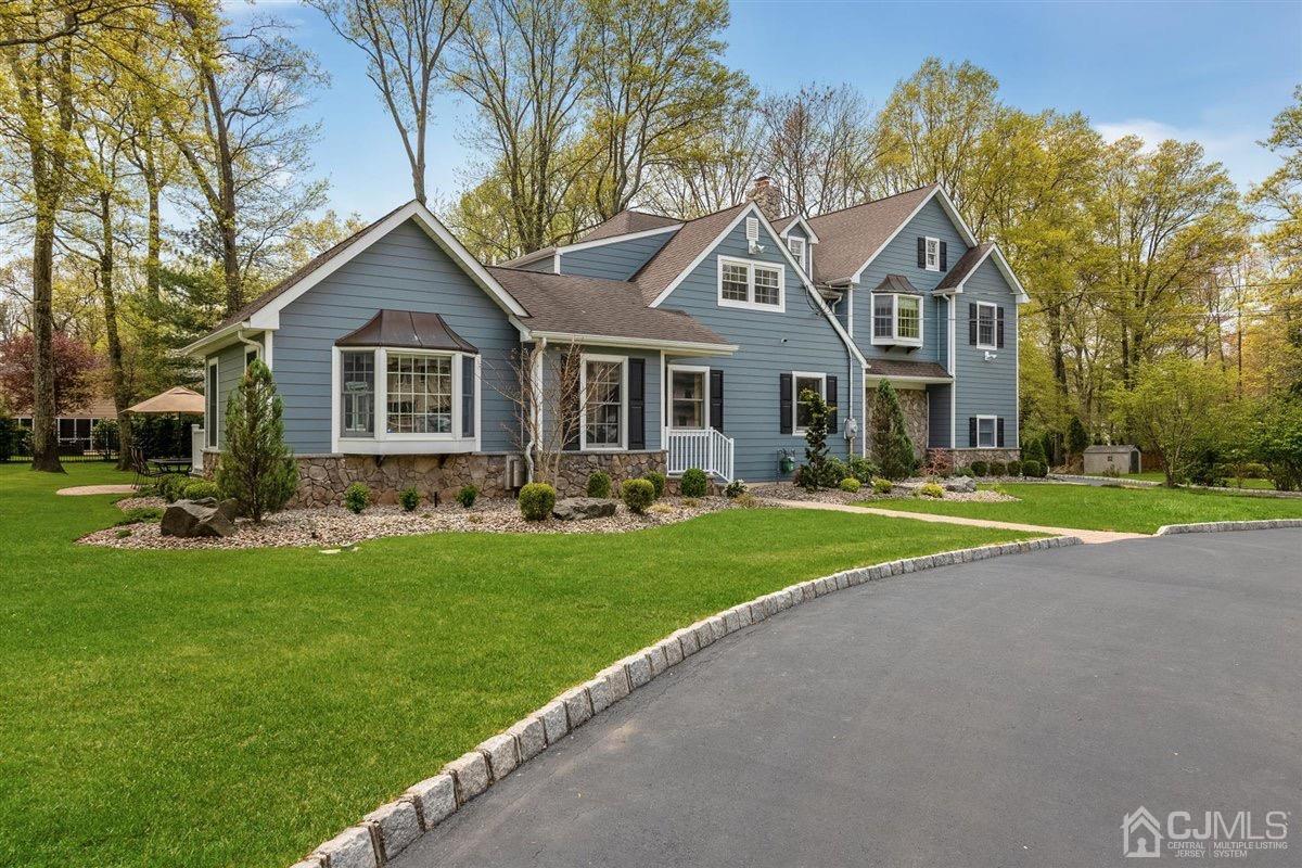 23 Southfield Road Edison, NJ 08820 - Photo 3 of 57 a front view of a house with a yard and trees