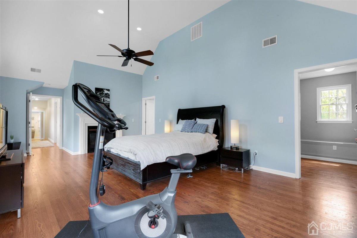 23 Southfield Road Edison, NJ 08820 - Photo 34 of 57 a bedroom with a bed and wooden floor