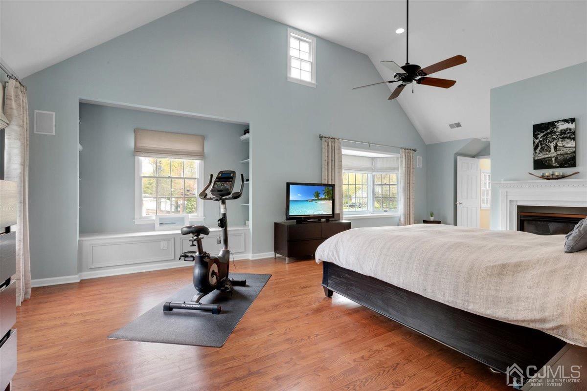 23 Southfield Road Edison, NJ 08820 - Photo 36 of 57 a bedroom with a bed and a chandelier