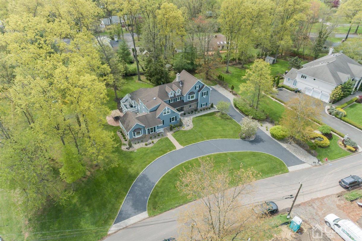 23 Southfield Road Edison, NJ 08820 - Photo 54 of 57 an aerial view of a house with a garden and swimming pool