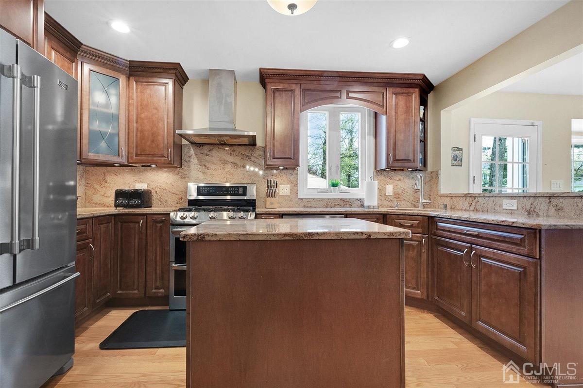 23 Southfield Road Edison, NJ 08820 - Photo 10 of 57 a kitchen with stainless steel appliances granite countertop a stove a sink and a refrigerator