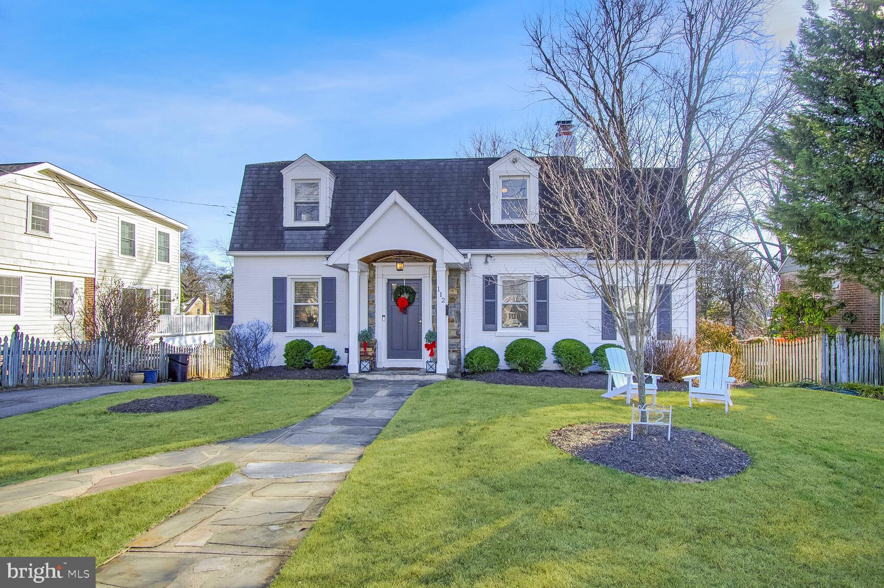 a front view of a building with garden