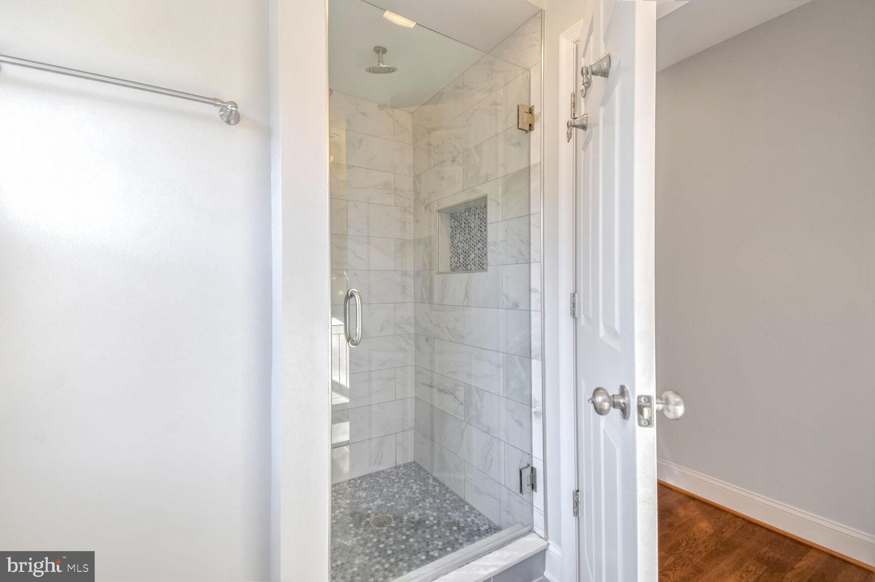 112 St Lawrence Drive Silver Spring, MD 20901 - Photo 14 of 30 a bathroom with a glass shower door
