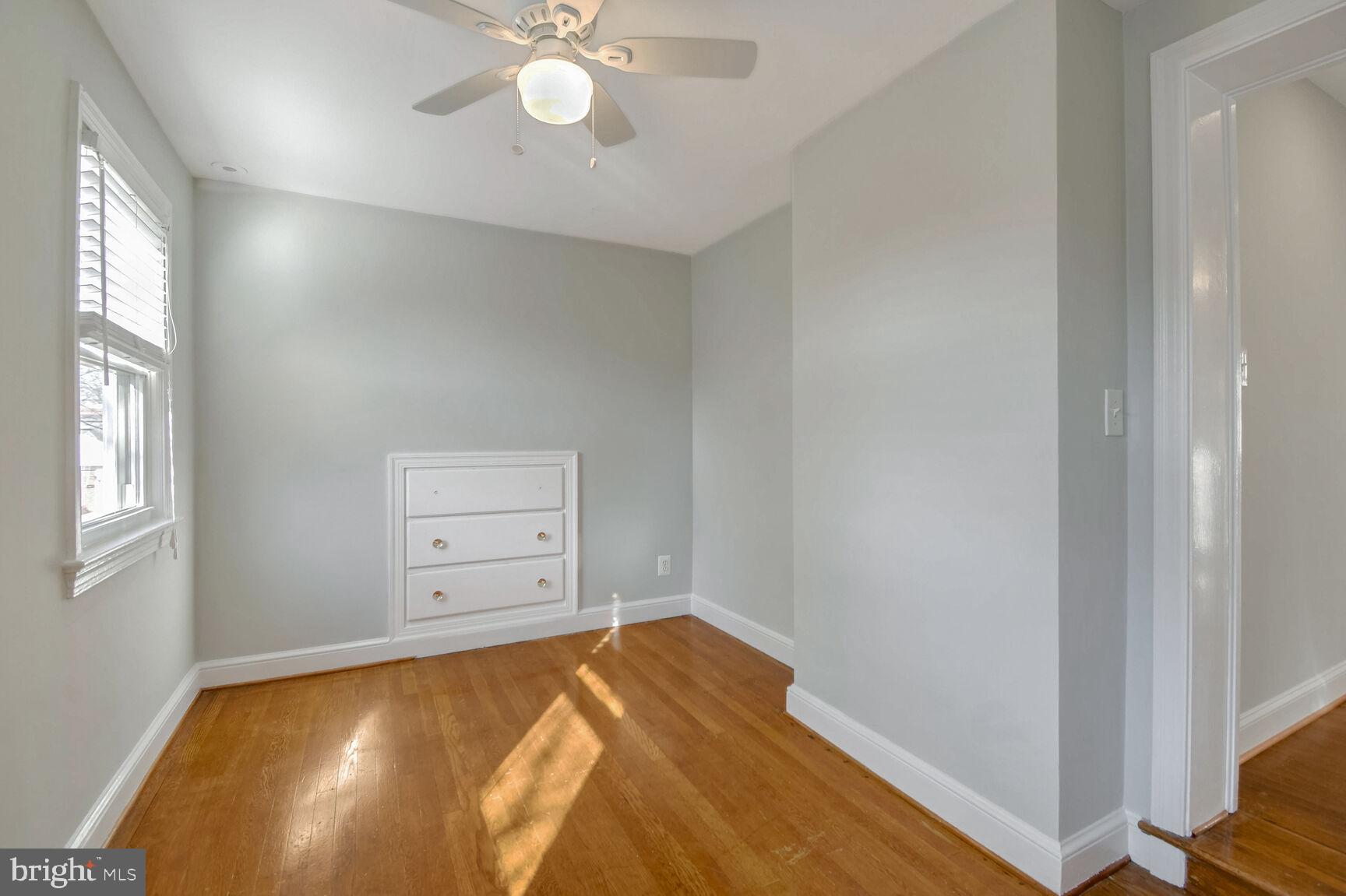 112 St Lawrence Drive Silver Spring, MD 20901 - Photo 15 of 30 a bedroom with a bed and a chandelier
