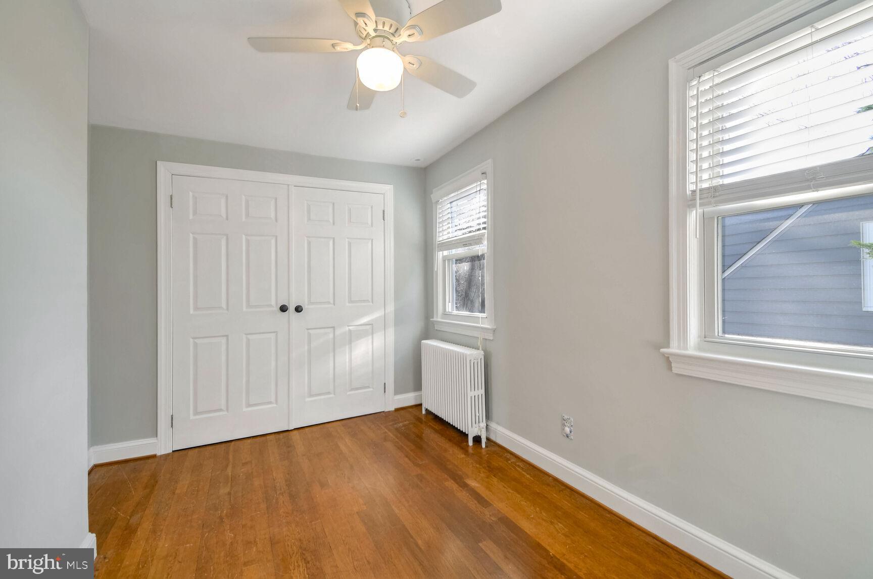 112 St Lawrence Drive Silver Spring, MD 20901 - Photo 17 of 30 a view of an empty room with wooden floor and a window