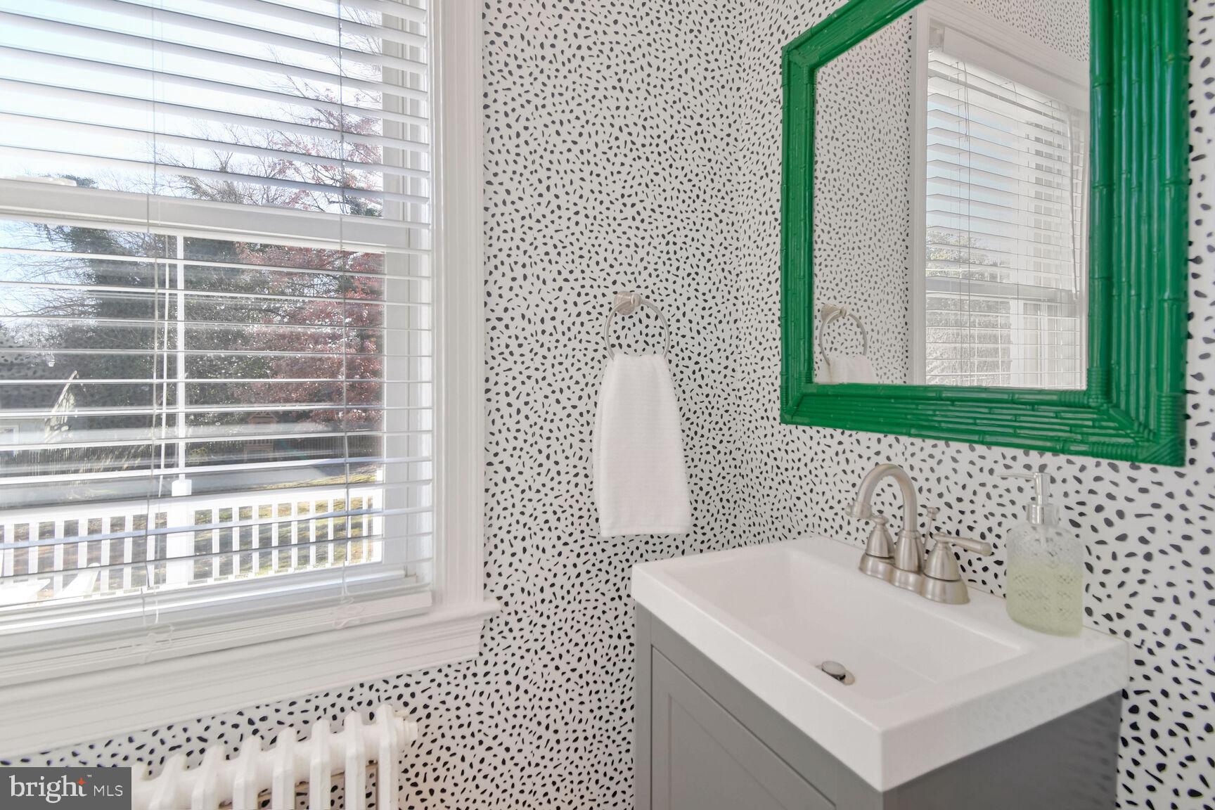 112 St Lawrence Drive Silver Spring, MD 20901 - Photo 19 of 30 a bathroom with a sink a toilet and a window