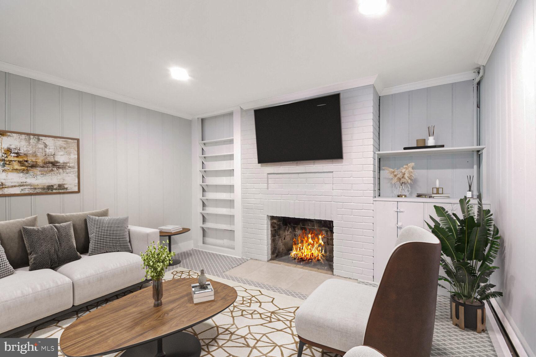 112 St Lawrence Drive Silver Spring, MD 20901 - Photo 22 of 30 a living room with furniture a fireplace and a flat screen tv