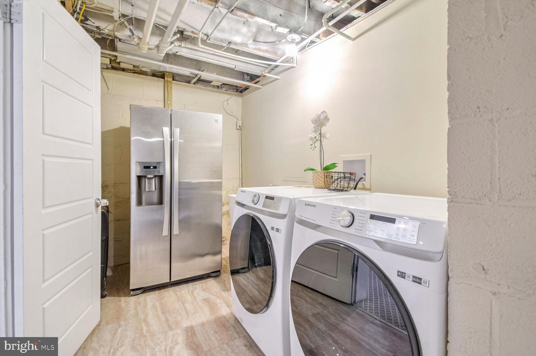 112 St Lawrence Drive Silver Spring, MD 20901 - Photo 25 of 30 a utility room with dryer and washer