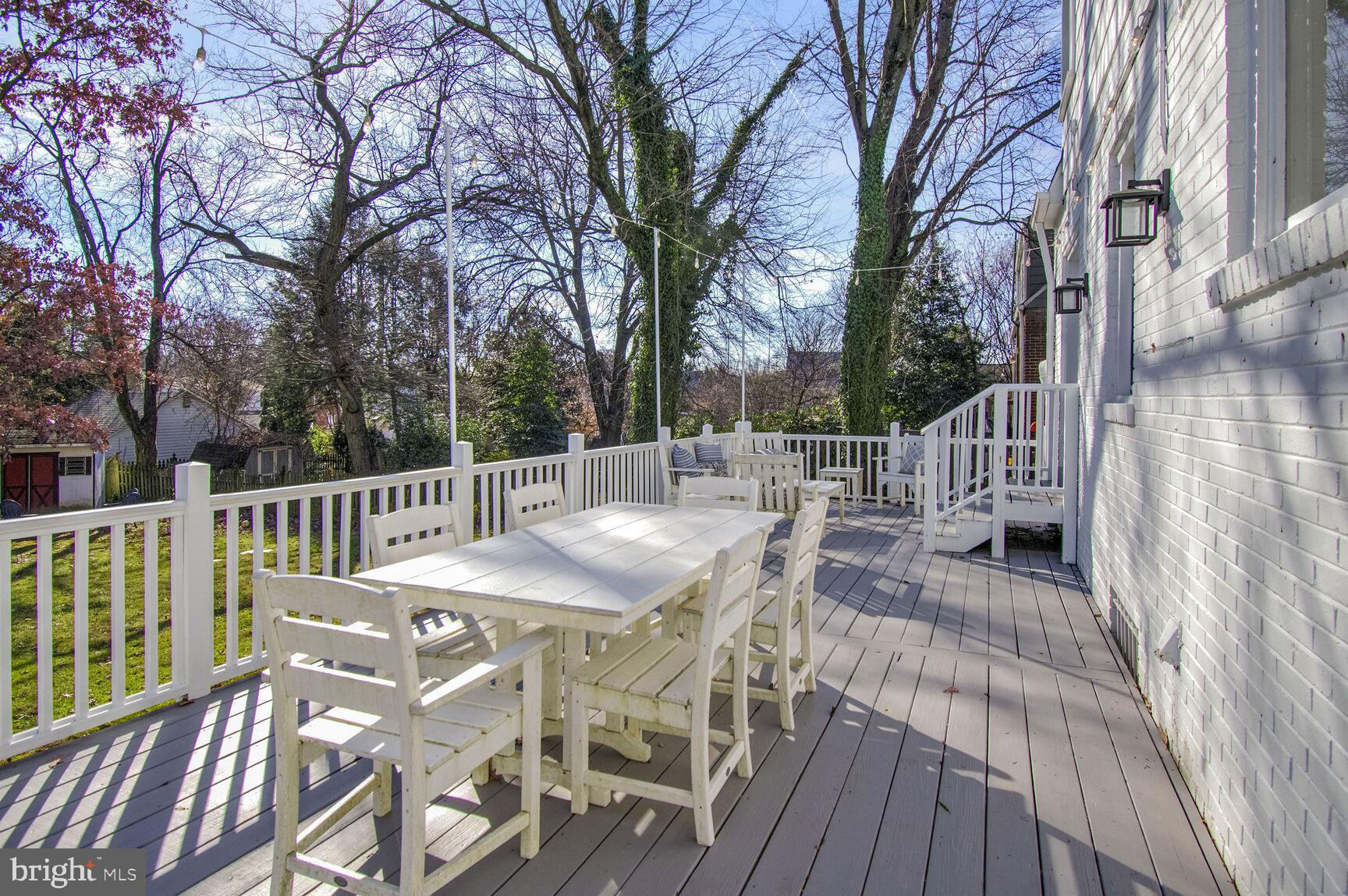 112 St Lawrence Drive Silver Spring, MD 20901 - Photo 26 of 30 a view of a deck with furniture and trees