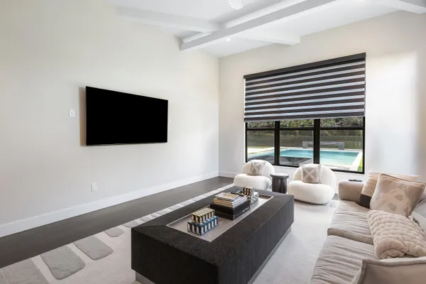 a living room with furniture and a flat screen tv