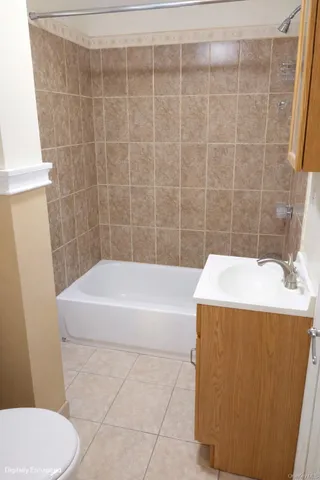 a bathroom with a sink a toilet and bathtub
