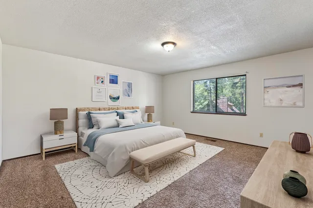 a bedroom with a bed and a couch