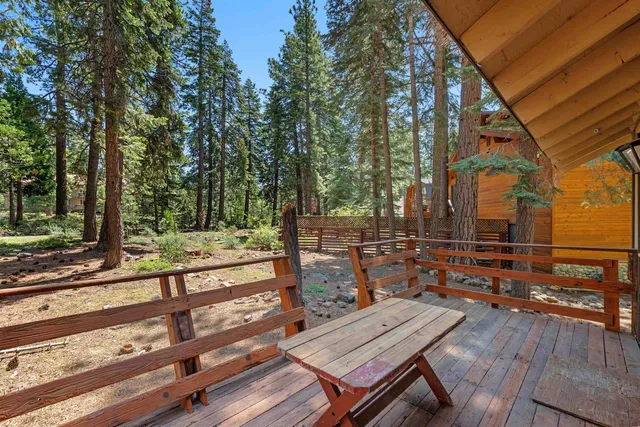 a view of a deck with wooden floor and outdoor space