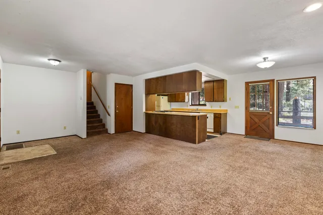 a view of a kitchen with a stove top oven
