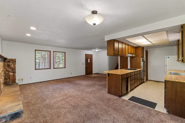 a view of kitchen with furniture and a window