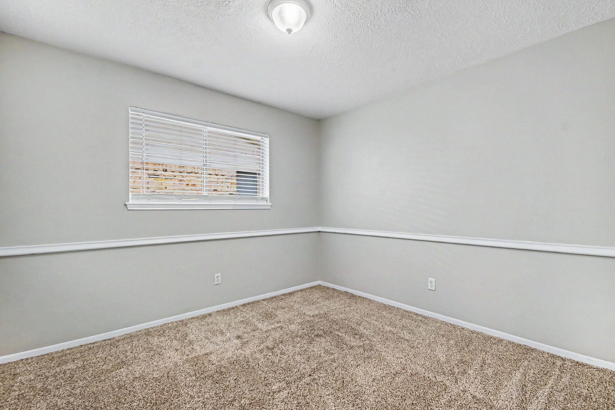 4306 Oneida Street Pasadena, TX 77504 - Photo 17 of 23 a view of an empty room with a window
