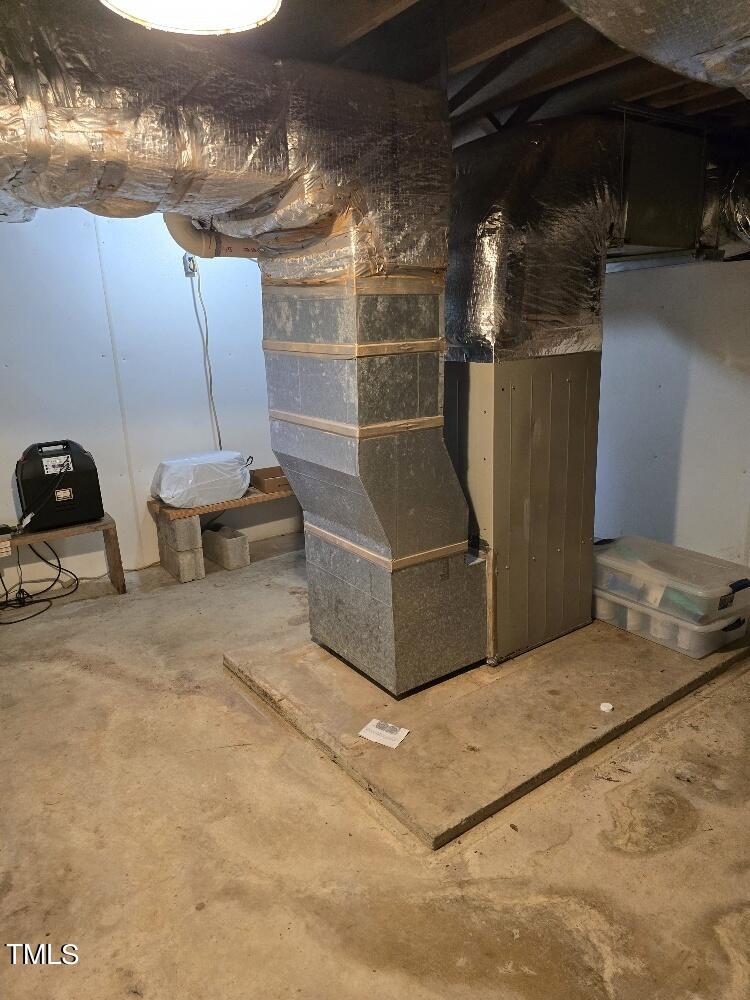 511 Providence Road Oxford, NC 27565 - Photo 37 of 56 Basement with concrete, sump pump, one part of duct work and access to under house. Has sump pump with battery backup. Also looks like another washer could go here