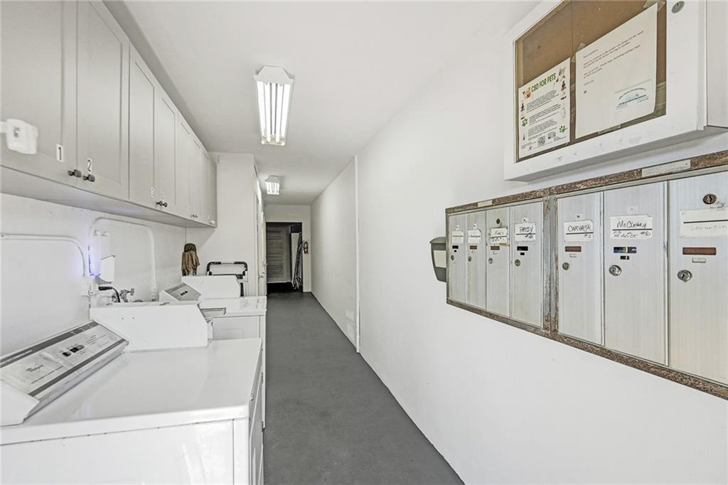 2131 Northeast 40th Court, Unit 1 Lighthouse Point, FL 33064 - Photo 13 of 16 a kitchen with granite countertop a sink a stove and a refrigerator
