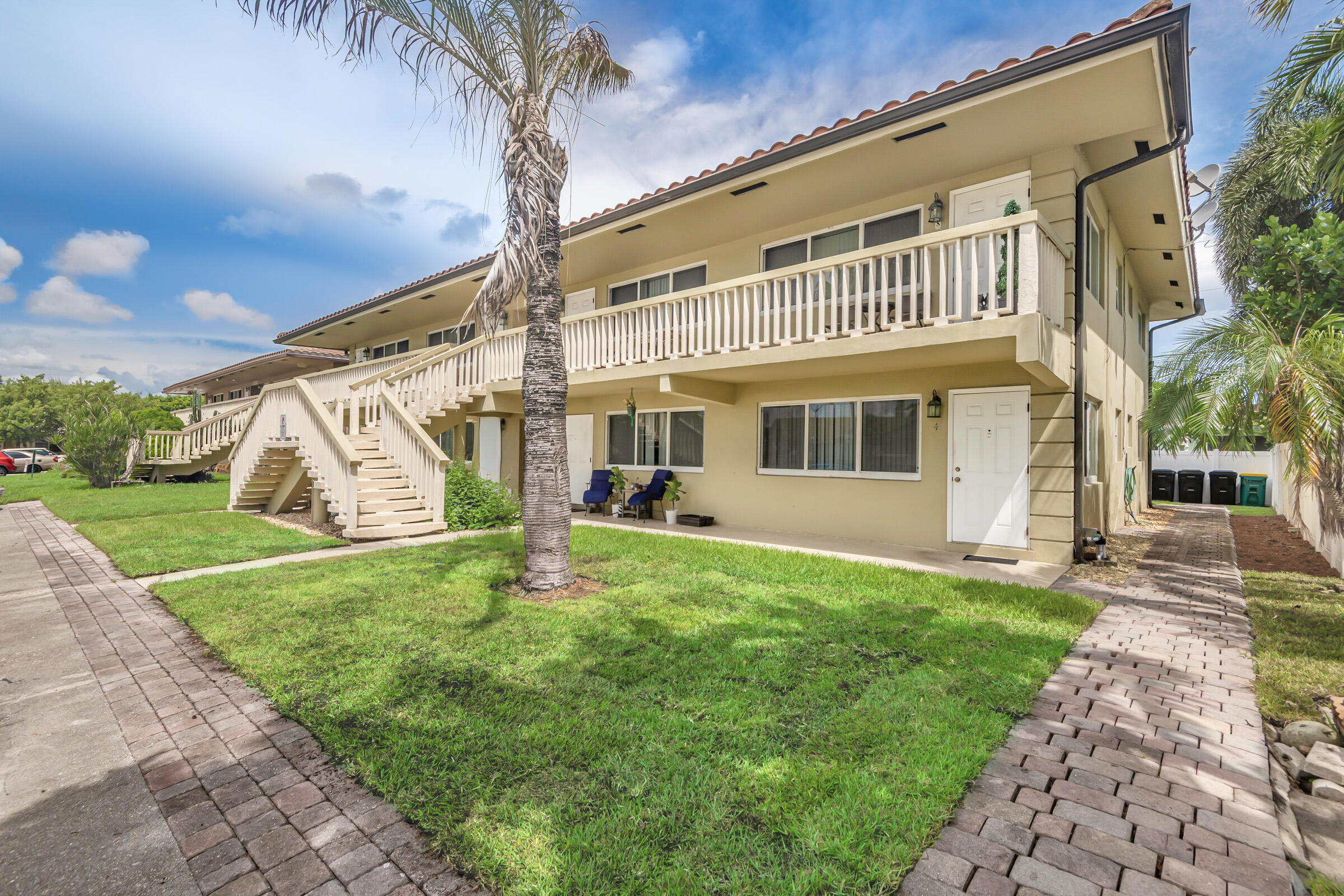 2131 Northeast 40th Court, Unit 1 Lighthouse Point, FL 33064 - Photo 2 of 16 a view of a house with a yard